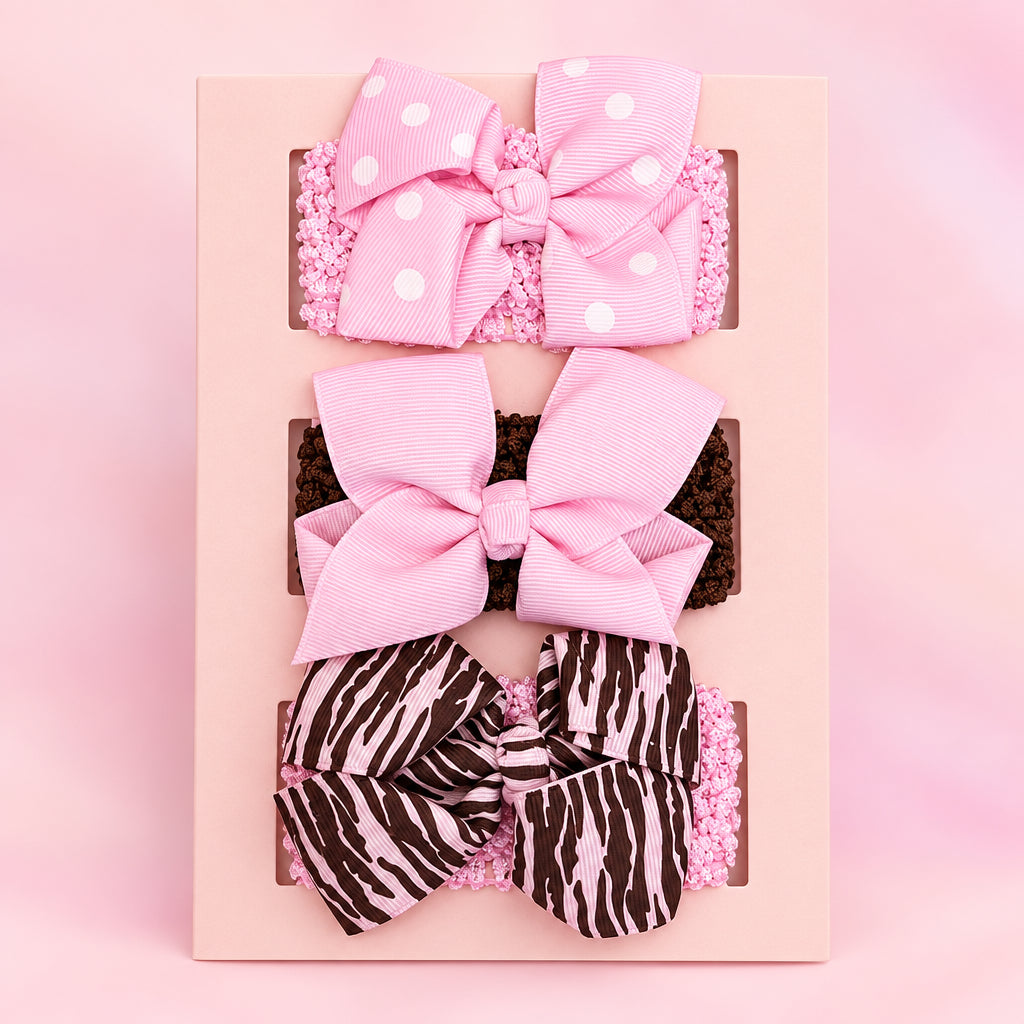 3-pack of baby girl headbands featuring pink polka dot, solid pink, and zebra striped bows