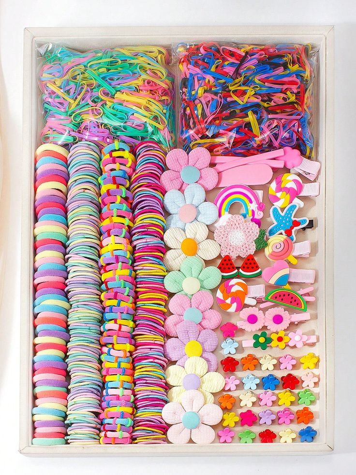 colorful children's hair accessory sets packaged in plastic flower-shaped containers