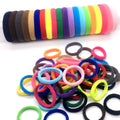 clear plastic tube filled with a rainbow-colored set of soft elastic hair ties.
